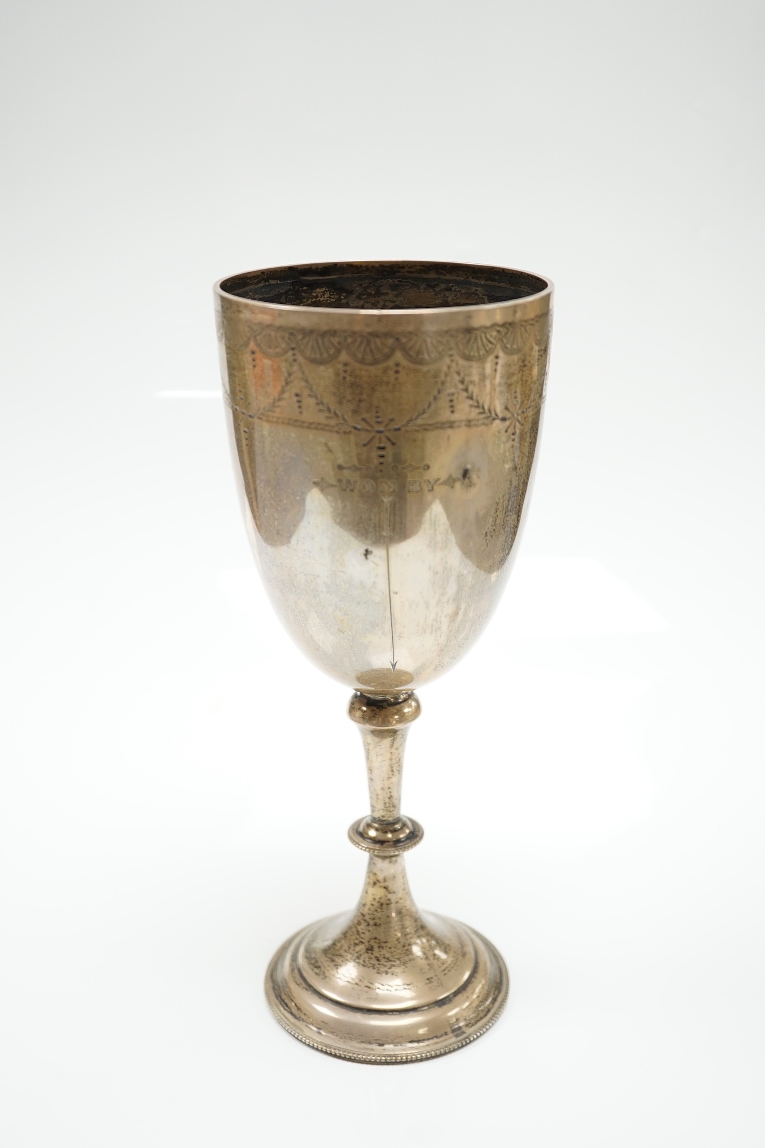 A late Victorian engraved silver presentation goblet, possible Charles Boyton, London, 1890, 23cm, 7.8oz.
